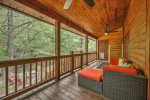 Entry level back deck over looking creek with doggy door